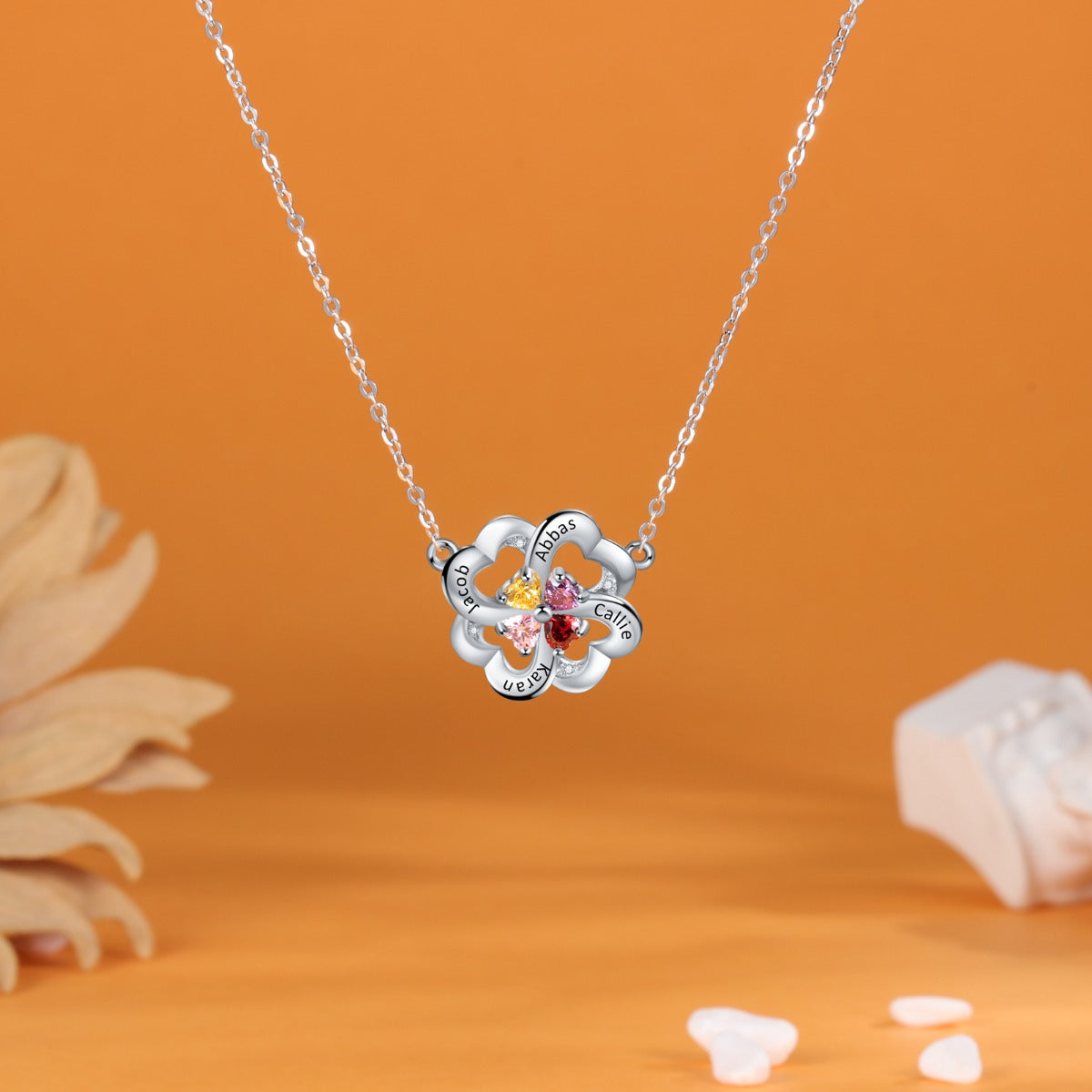 Custom name flower pendant with heart-shaped birthstones