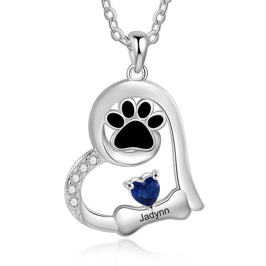 Heart-shaped pet necklace featuring custom name and birthstone.
