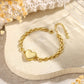 Gold-plated heart bracelet with closed locket and adjustable extension chain