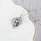 Engraved cage heart pendant with gemstone