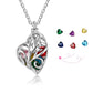 Silver cage heart necklace with birthstone and engraved tag.