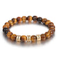 Tiger eye beaded men’s bracelet with engraved 3 gold beads. 